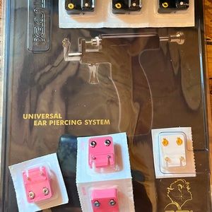 Ear piercing kit with assorted earrings